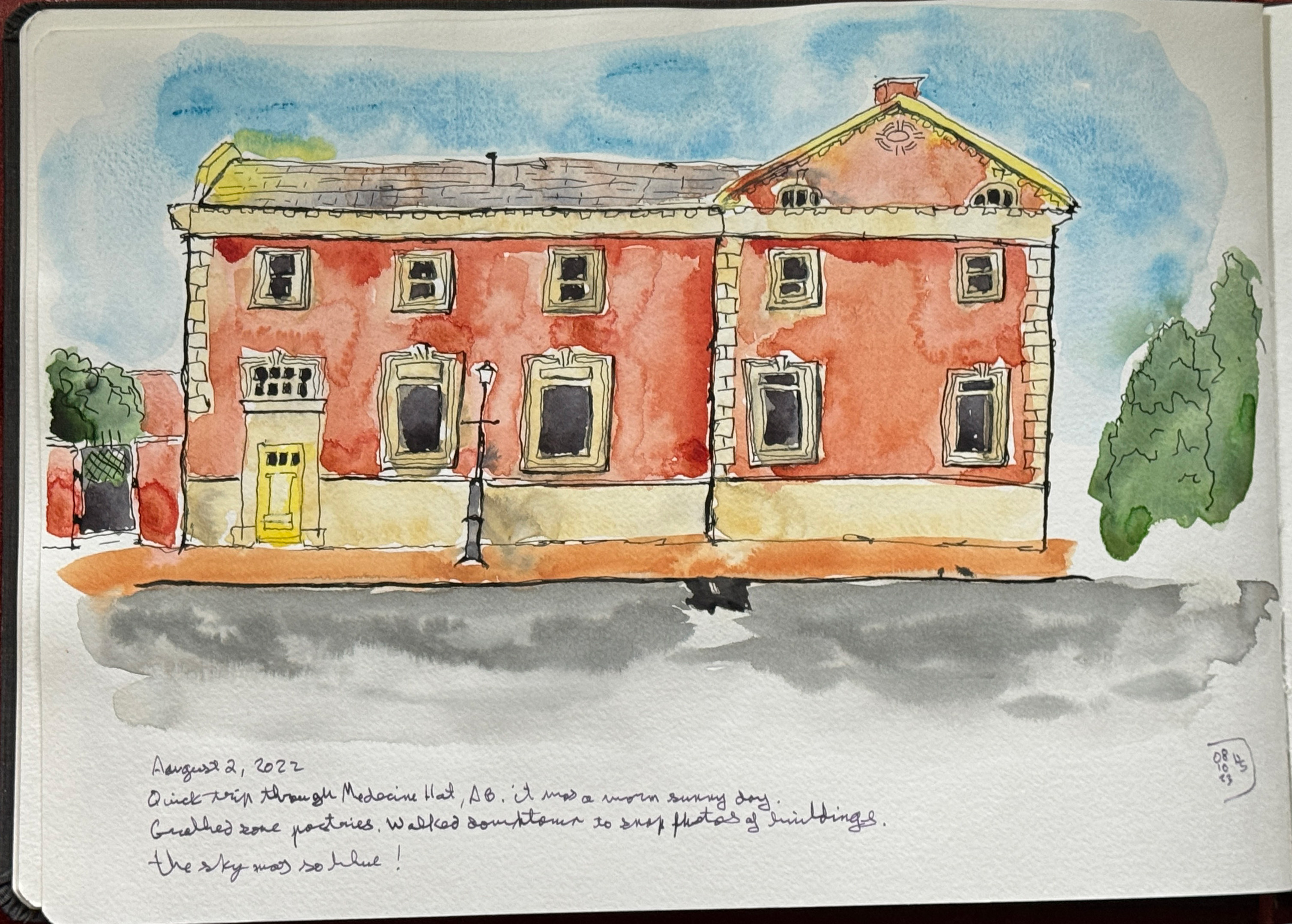 Line and wash sketch. Old stone and brick building. August 2, 2022. Quick trip through Medicine Hat, AB. It was a warm sunny day. We grabbed some pastries. Walked downtown to snap photos of buildings. The sky was so blue!